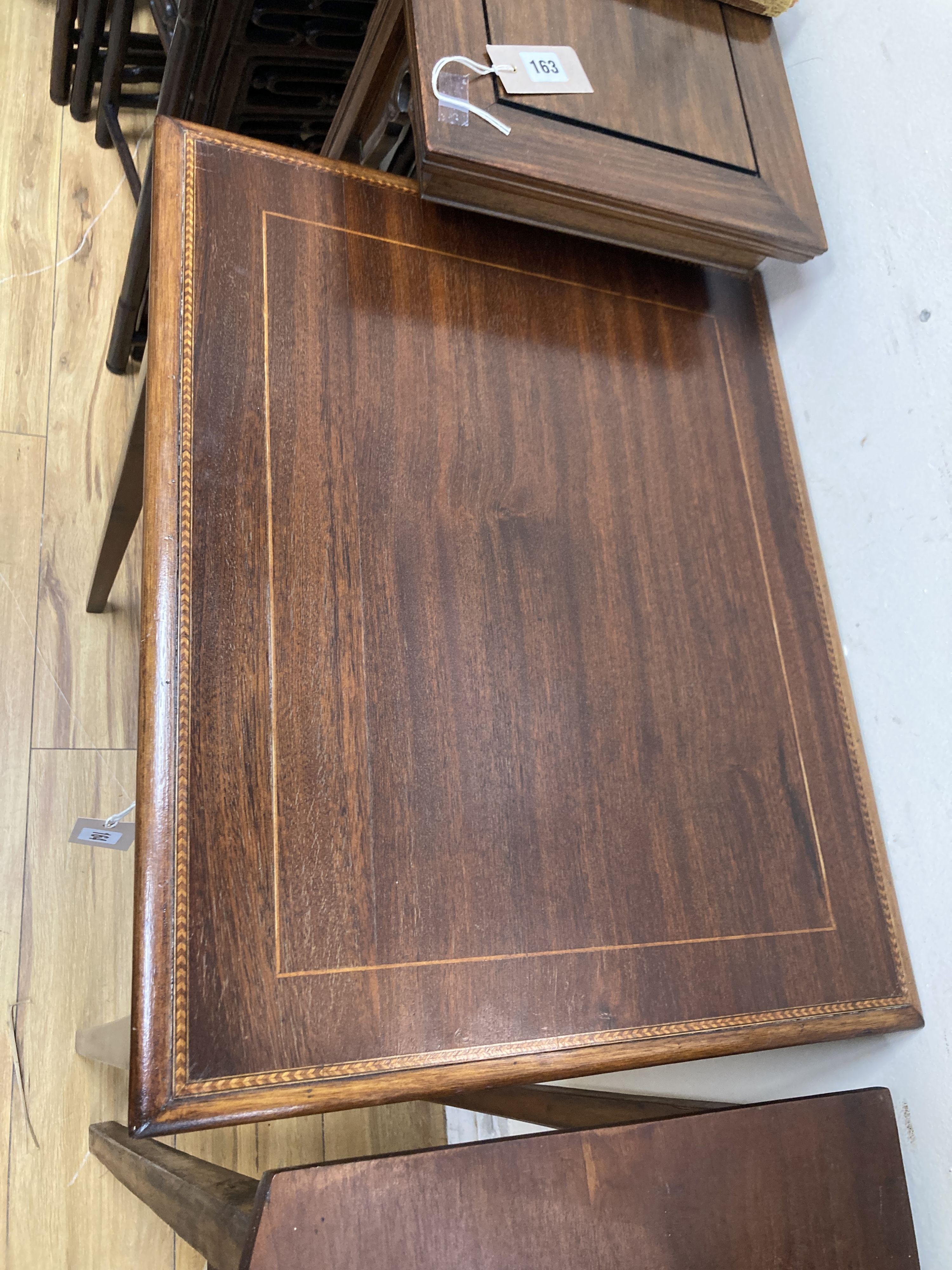 An Edwardian rectangular mahogany occasional table. W-57, D-47, H-73cm.